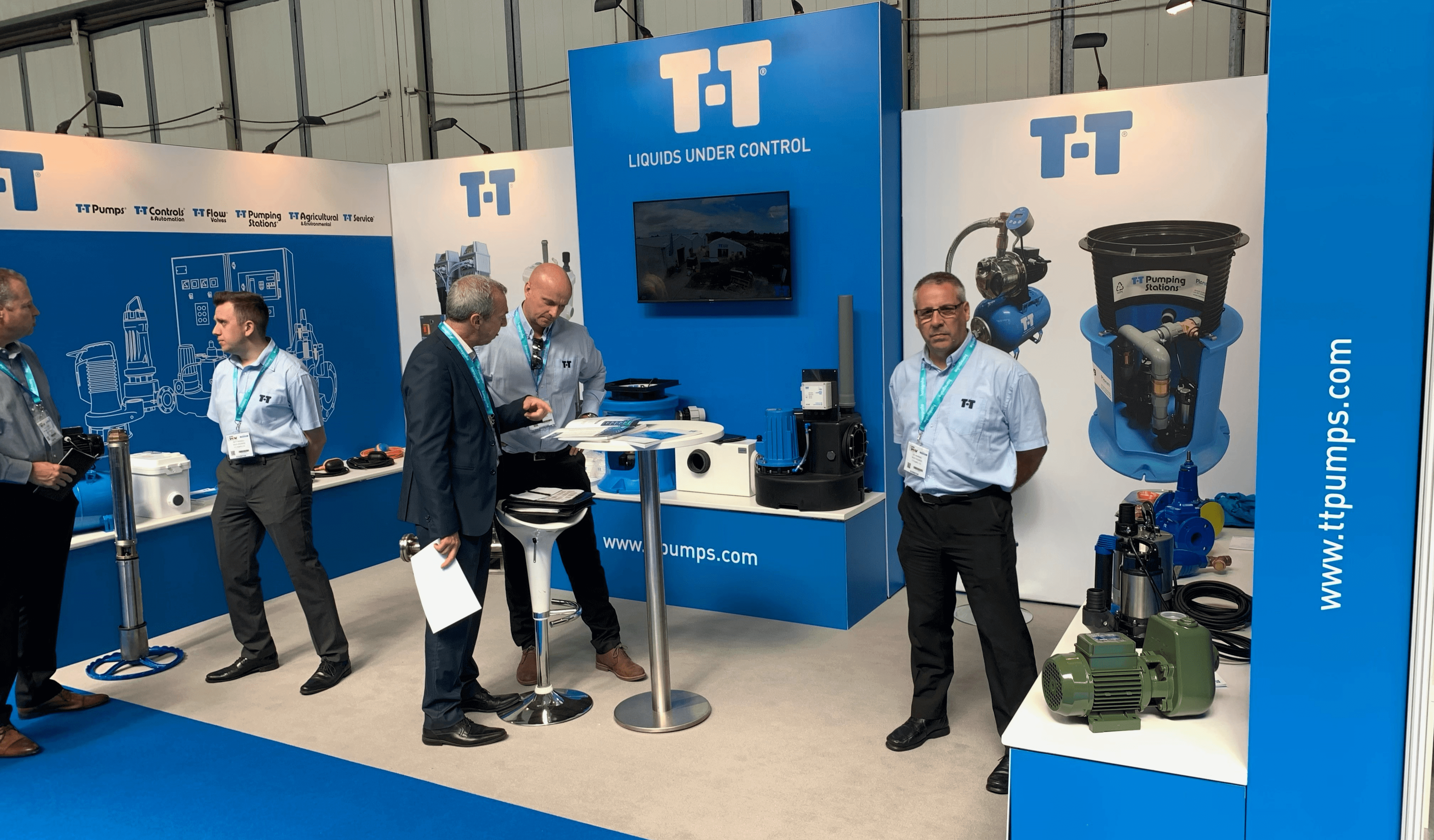 T-T Pumps team members at Installer Show 2022 display stand.