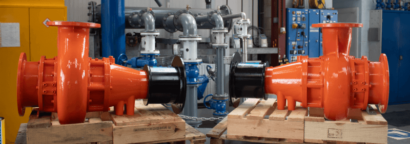 Two orange ETO chopper pumps from Cri-Man in T-T's Repairs Workshop.