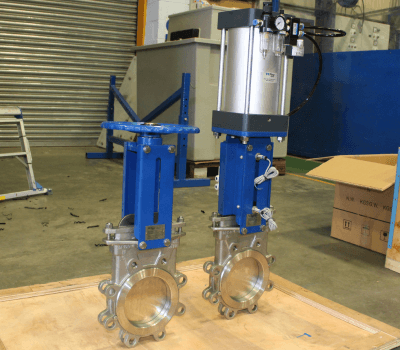 Custom actuated stainless steel knife gate valves.