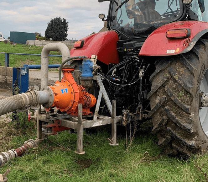 Cri-Man chopper pump mounted on tractor.