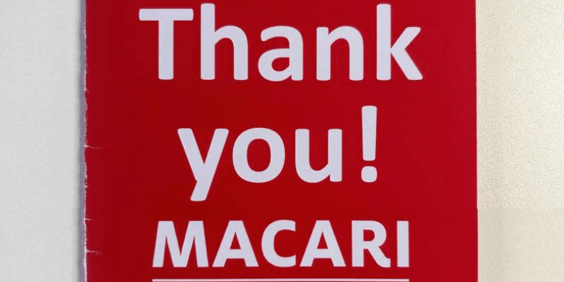 Red thank you card from the Macari Foundation charity.
